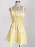Minivestido amarillo pastel sin mangas con cuello anudado y corte en A