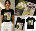 Camiseta negra con ilustración artística de figuras femeninas y flores con pedrería